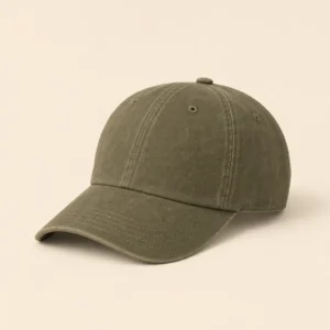 Front three-quarter view of the faded-olive Fallow Trail Canvas Cap on the warm oatmeal catalog background